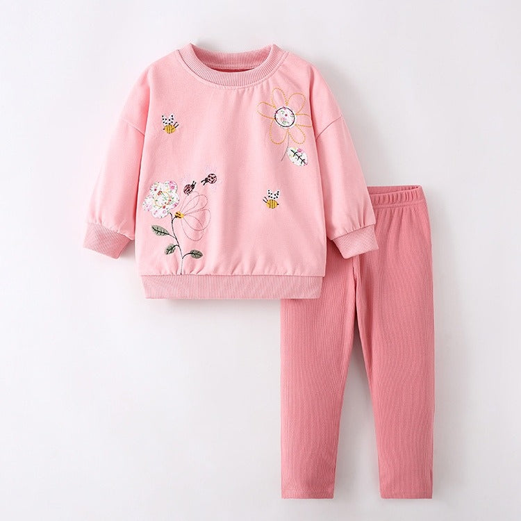 Conjunto suéter más calza rosa vieja detalles de flores bordados