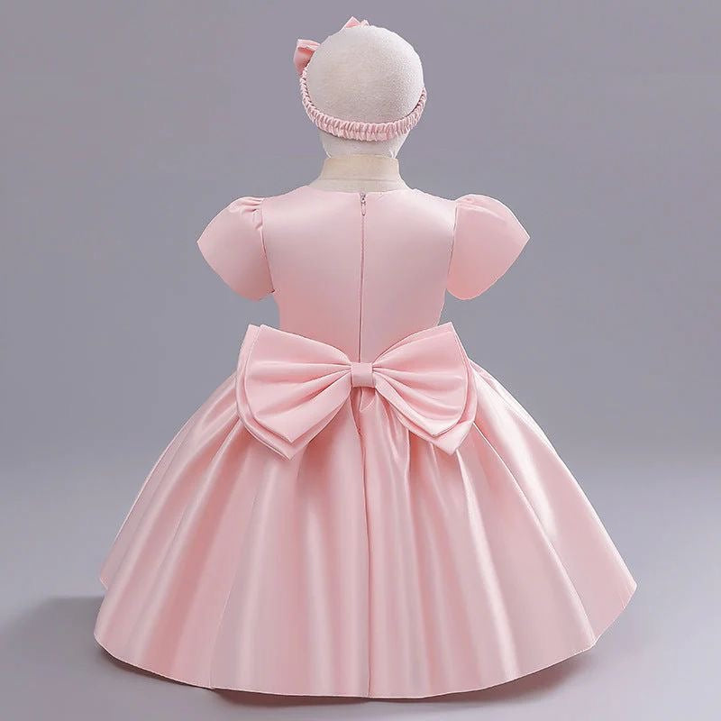 Vestido elegante para bebés , rosa con mangas incluye vincha