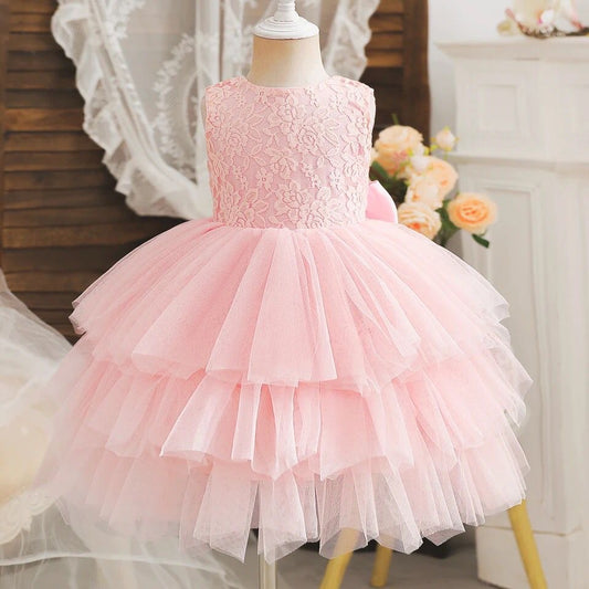 Vestido elegante para bebés rosa , con flecos y espalda baja