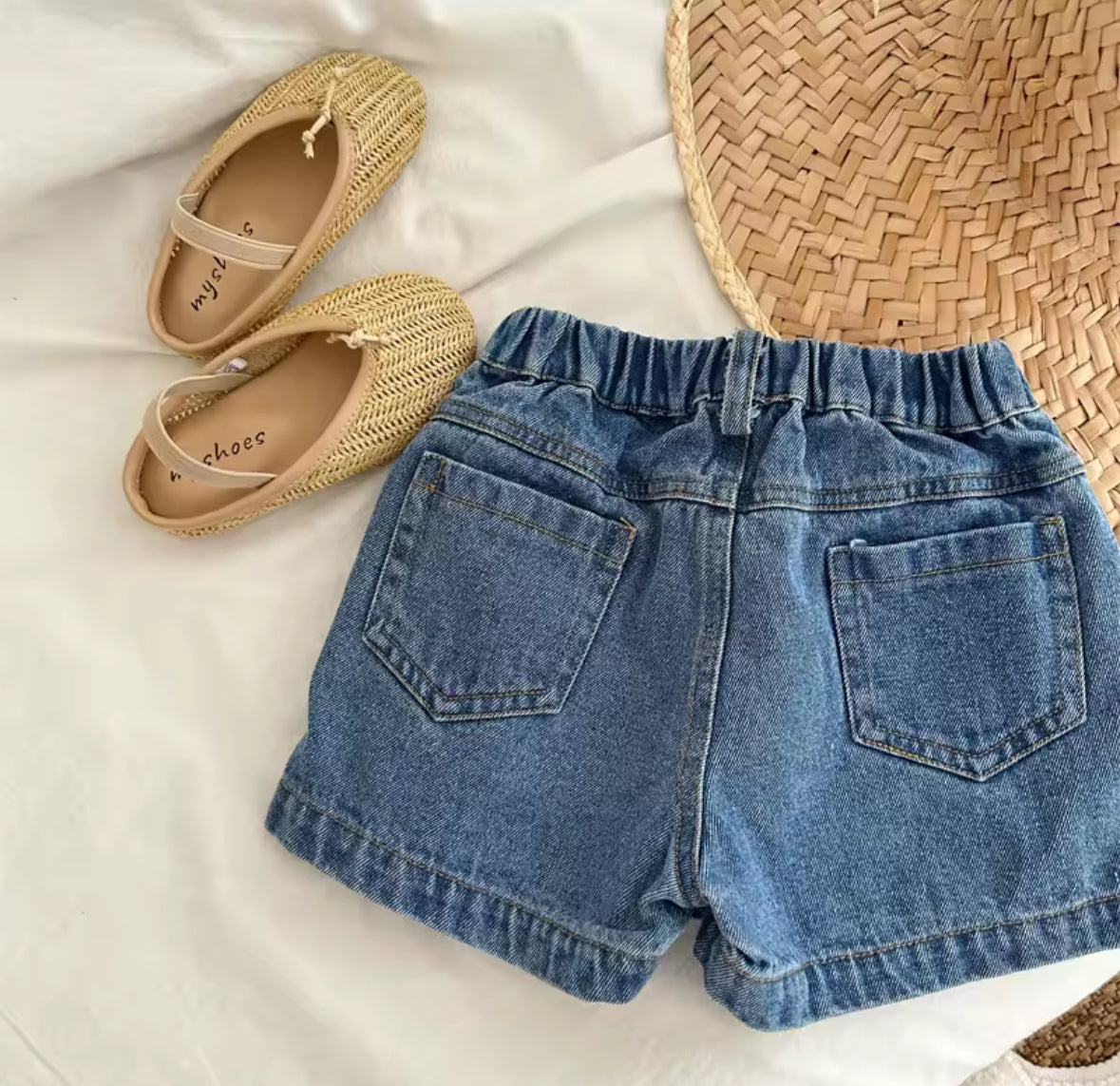 Short pollera de jeans detalles de moñitos