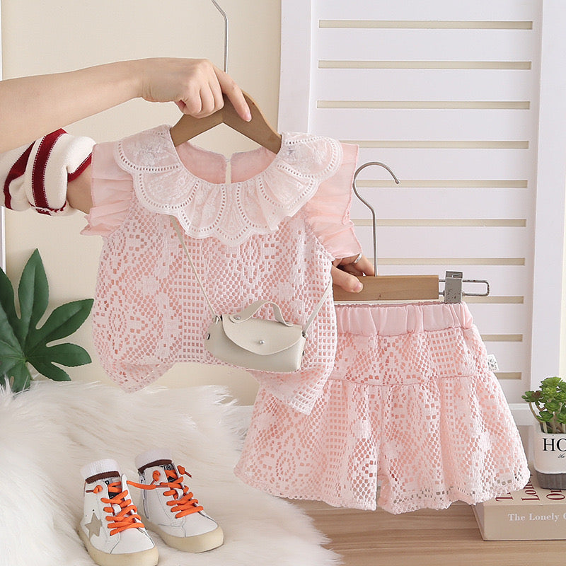 Conjunto short sueltito con blusa rosa incluye una pequeña cartera