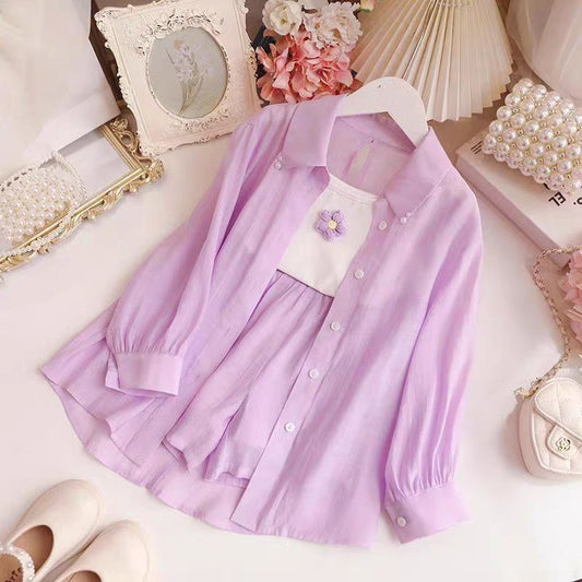 Conjunto lila de 3 piezas ( camisa , short y camisilla)
