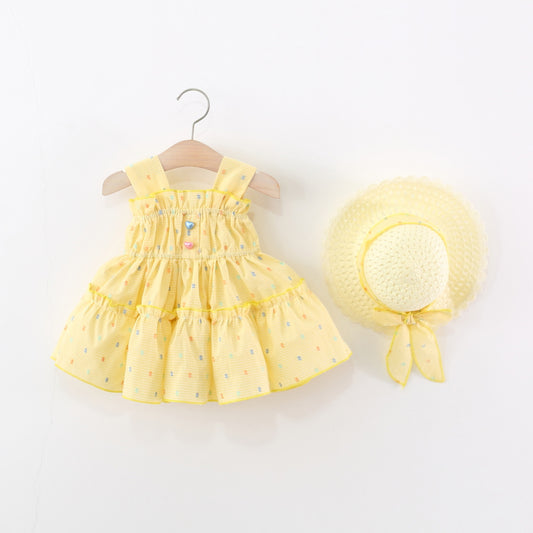 Vestido amarillo con sombrero detalle de motas