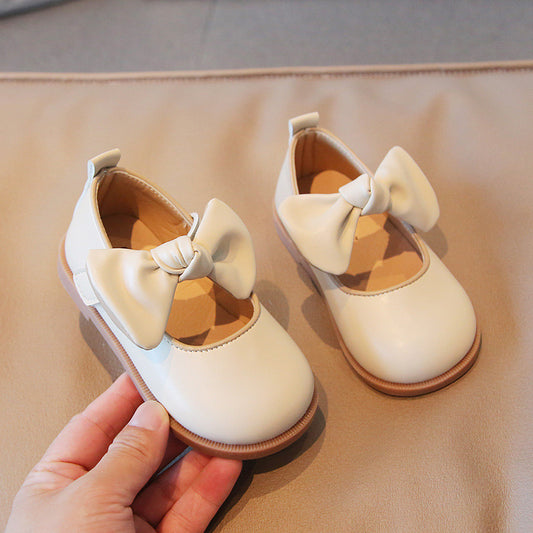 Zapatos beige con moño