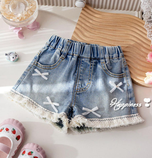 Short de jeans detalles de moñitos y flecos