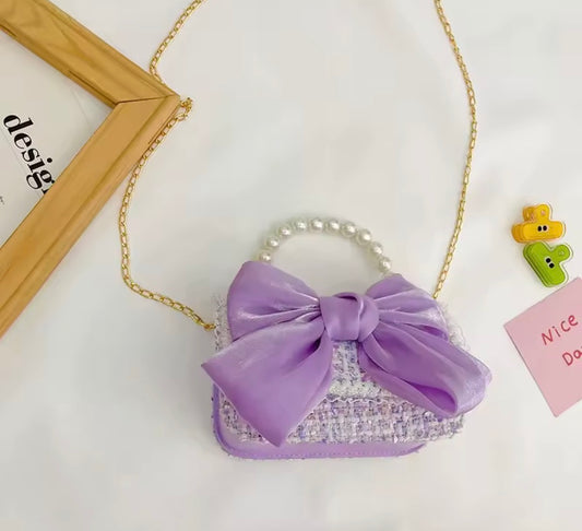 Carteras con moño y perlas rosa, lila y negro