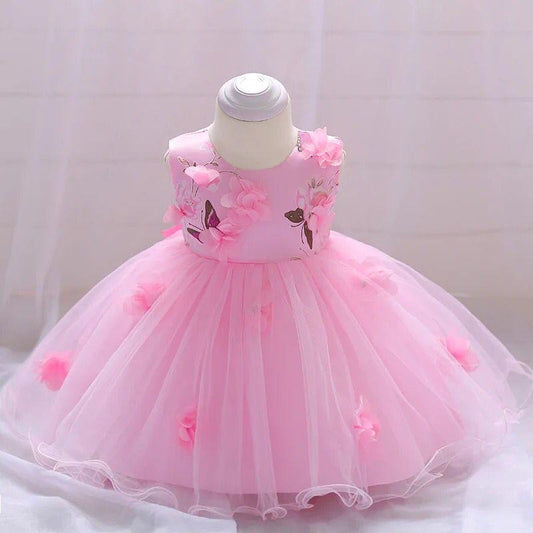 Vestido elegante para bebés , colores rosa con detalles de mariposas y flores en 3D